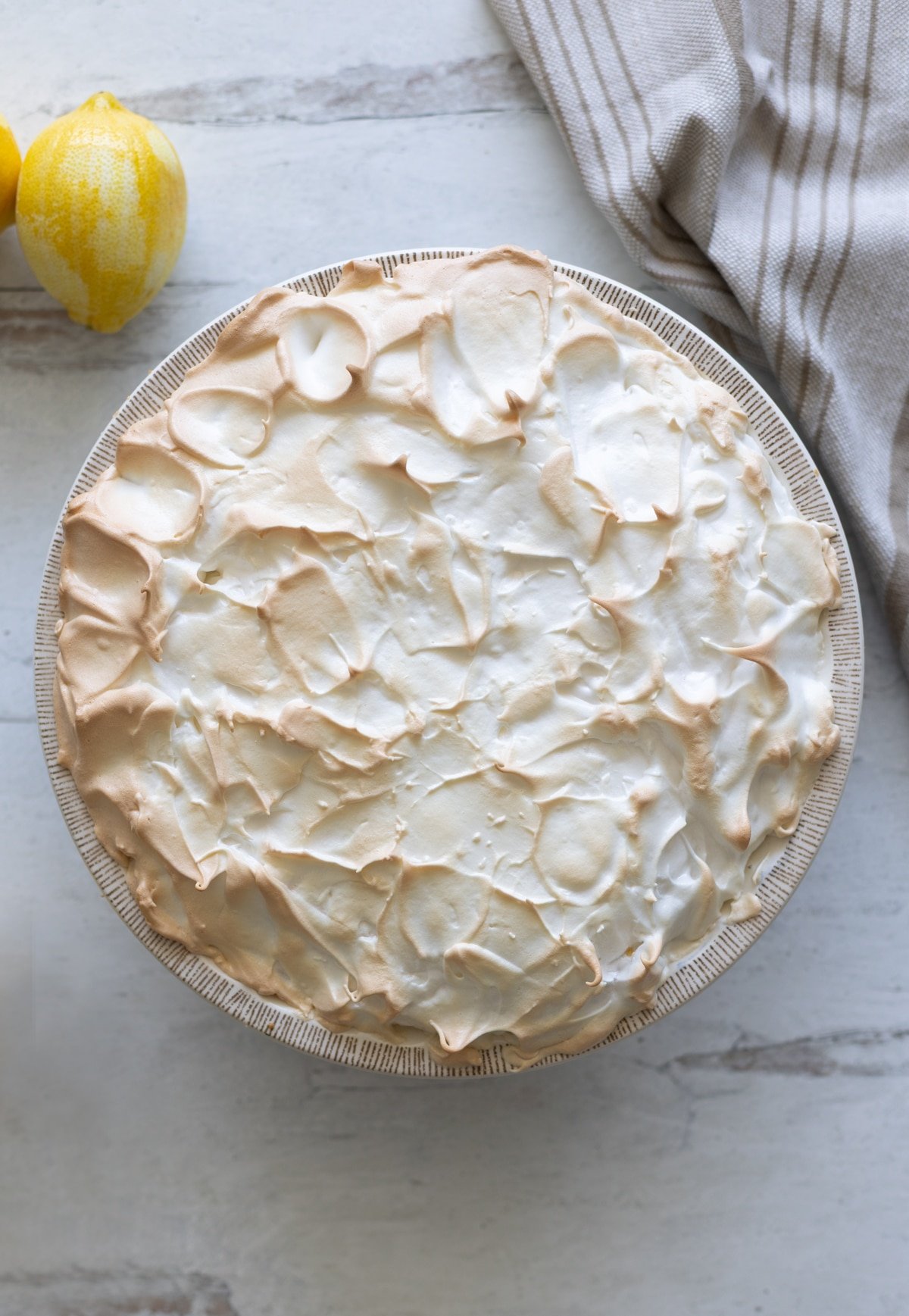 Sweet, tangy, and absolutely stunning—this Lemon Meringue Pie is made with a buttery graham cracker crust with a silky lemon filling and golden meringue that's toasted to perfection. It’s a dessert that says “Wow” without you having to say a word!