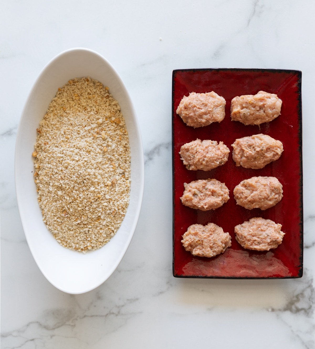 Turkey tots ready to be dipped into a breadcrumb mixture.