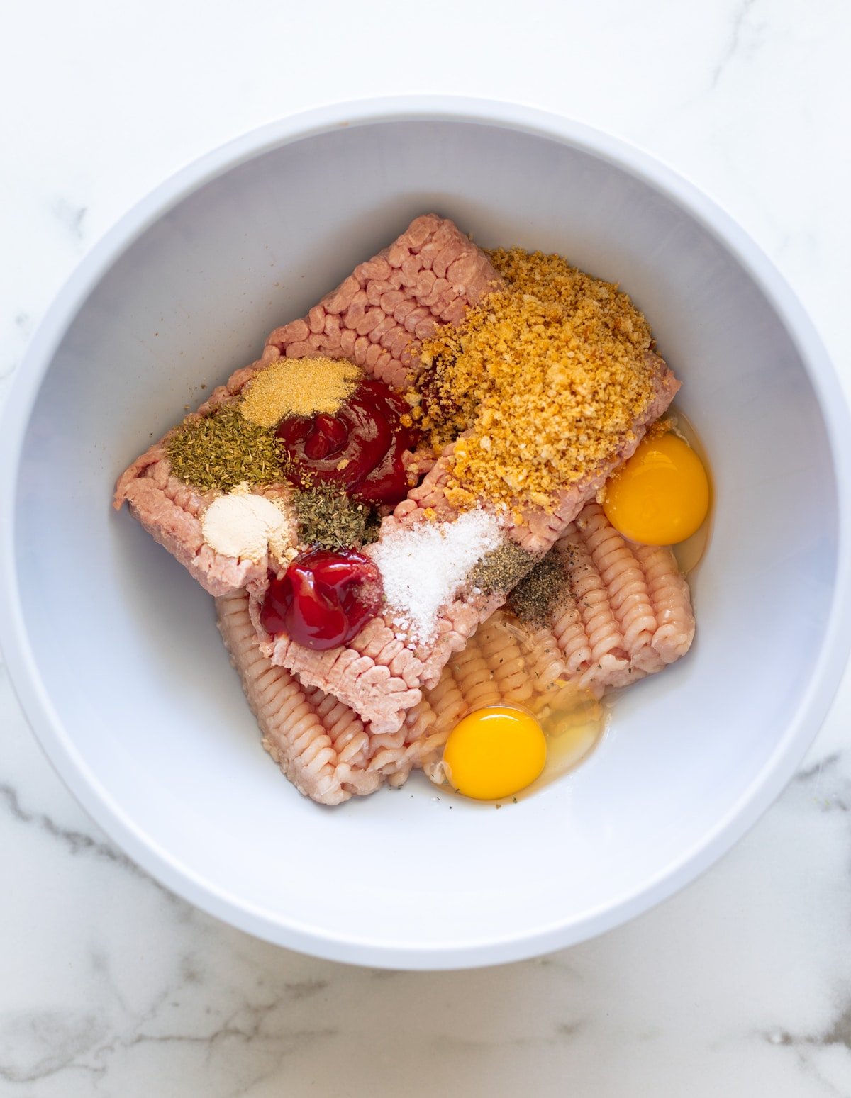 Bowl containing ingredients to make turkey tots.