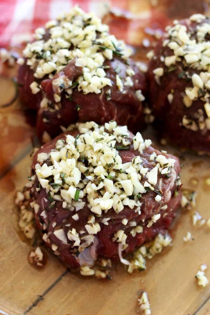 3 filet steaks marinated in garlic and rosemary and olive oil.