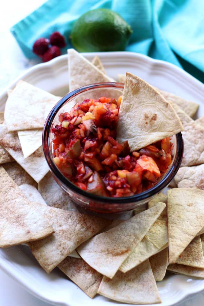 A plate of tortilla chips and salsa
