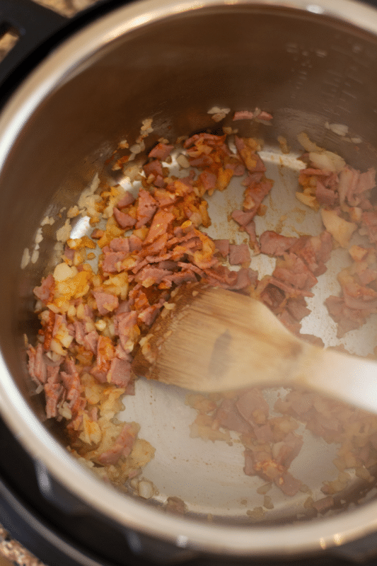Sauteed bacon, garlic and onions in an Instant Pot.