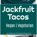 Teal plate on a table containing 2 jackfruit tacos topped with purple cabbage and avocado.
