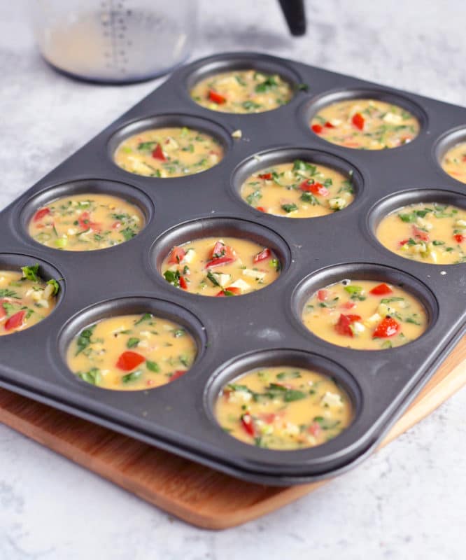 Unbaked egg muffins in the muffin pan