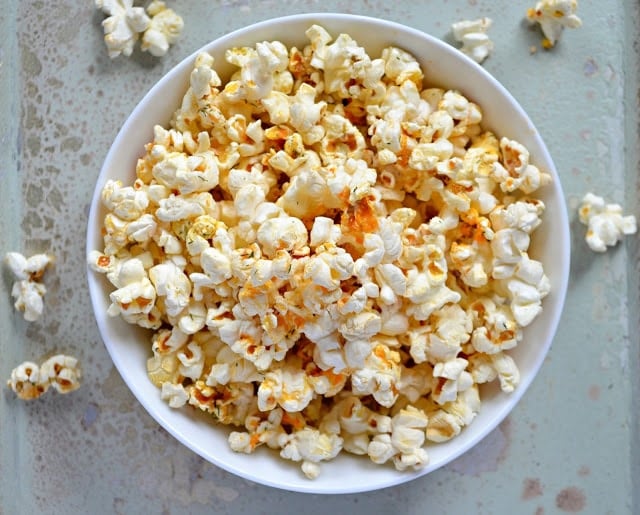 Buffalo ranch seasoned popcorn in a white bowl.