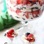 Berry trifle made with cream, 2 parfait dishes filled with trifle