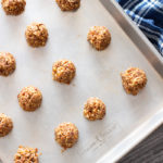 Cookie sheet filled with bite-size protein bites.