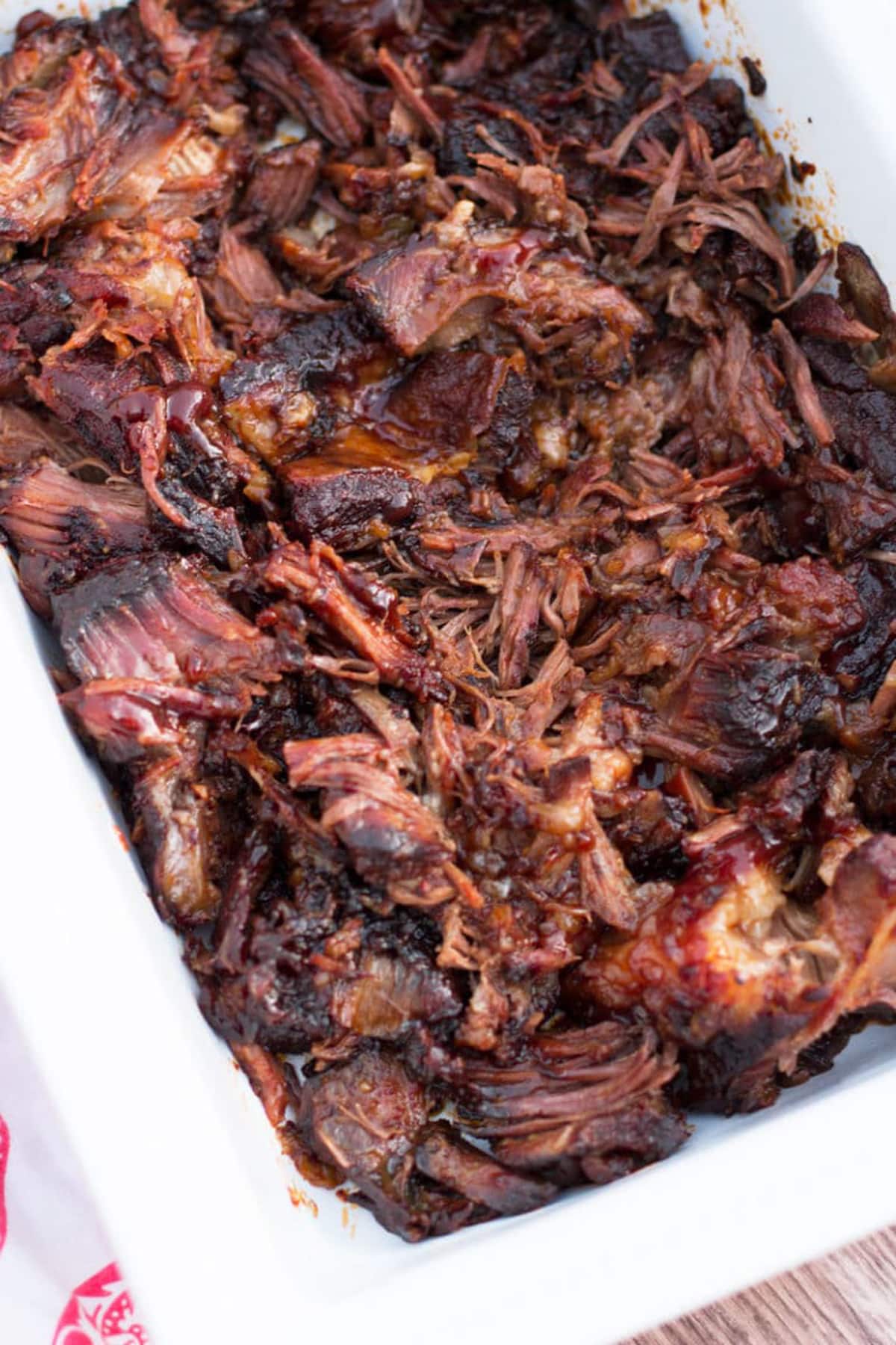 Shredded short ribs in a dish.