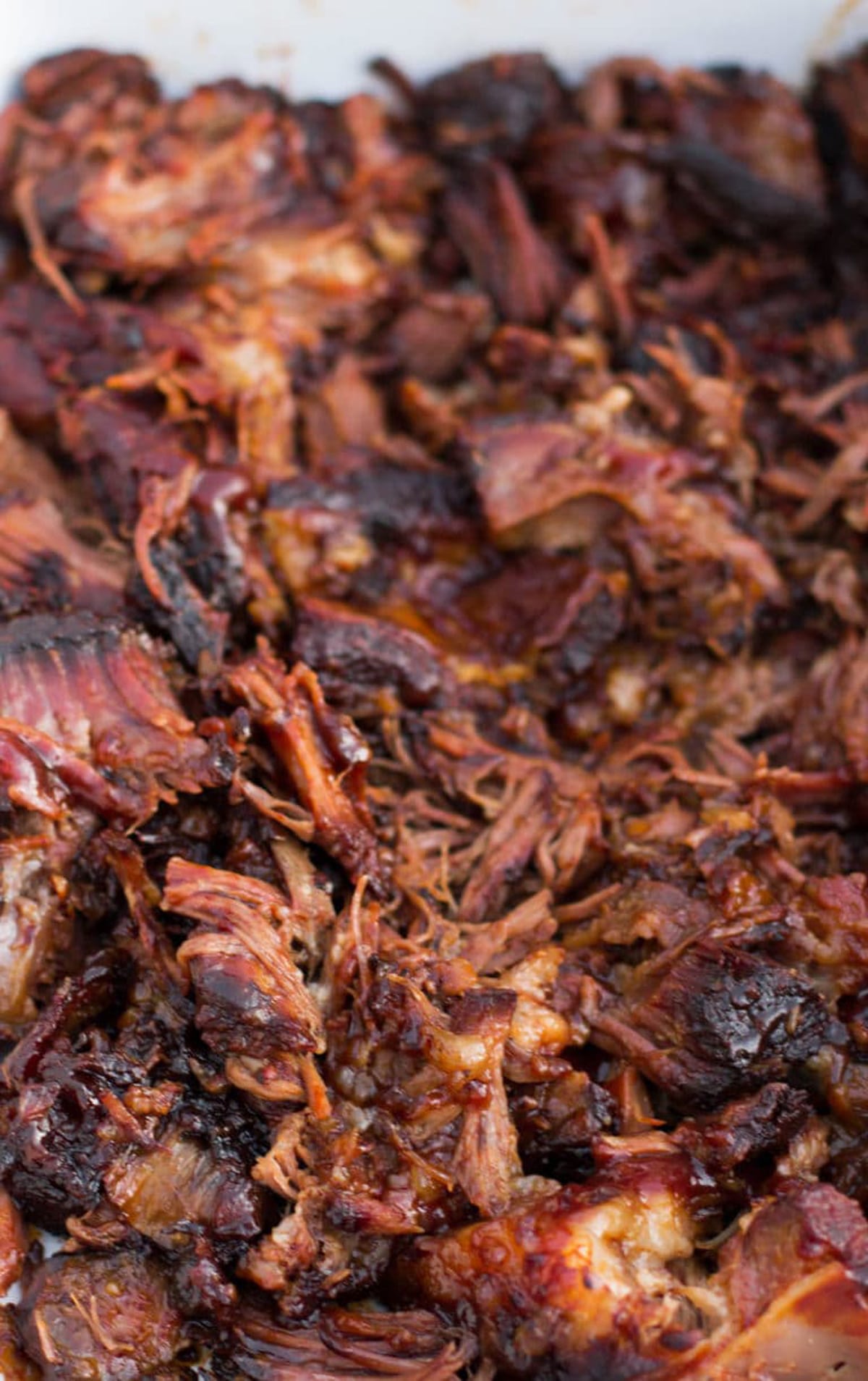 Close up of shredded beef ribs in a platter.