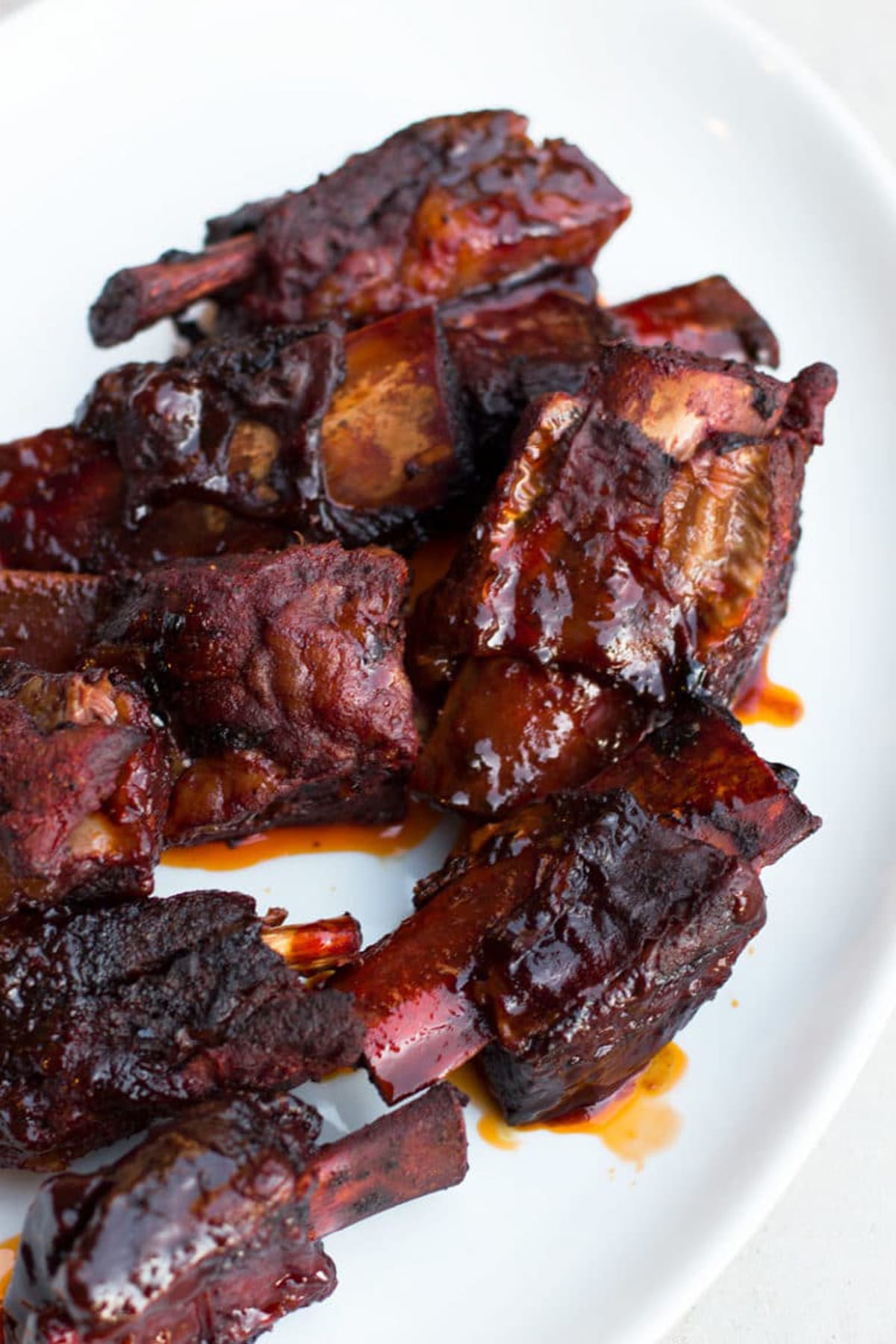 Cooked slow cooker beef short ribs on the bone.