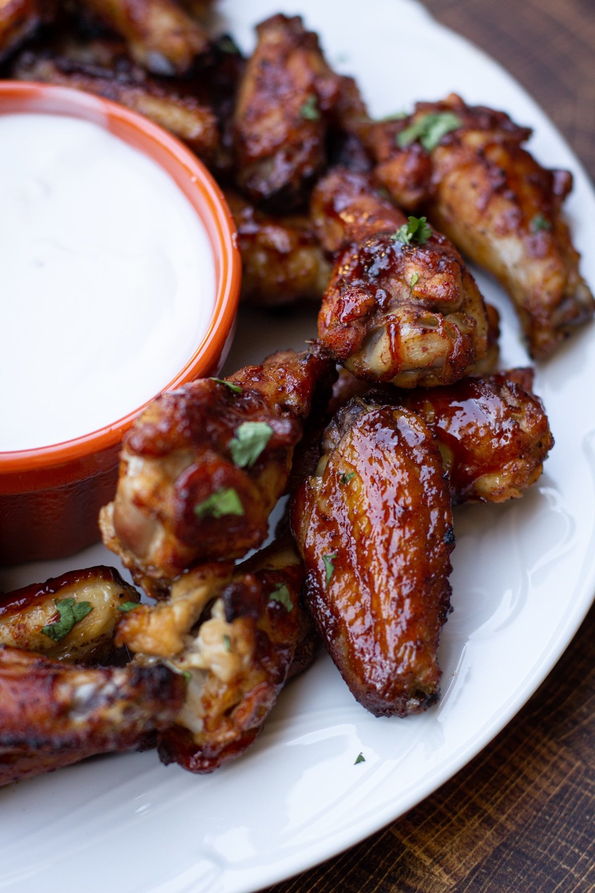 Close up on Smoked BBQ chicken wings on a plate.