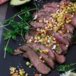 Flank steak topped with feta cheese and corn salsa.
