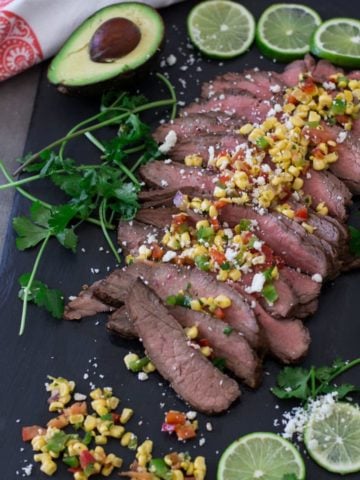Flank steak topped with feta cheese and corn salsa.