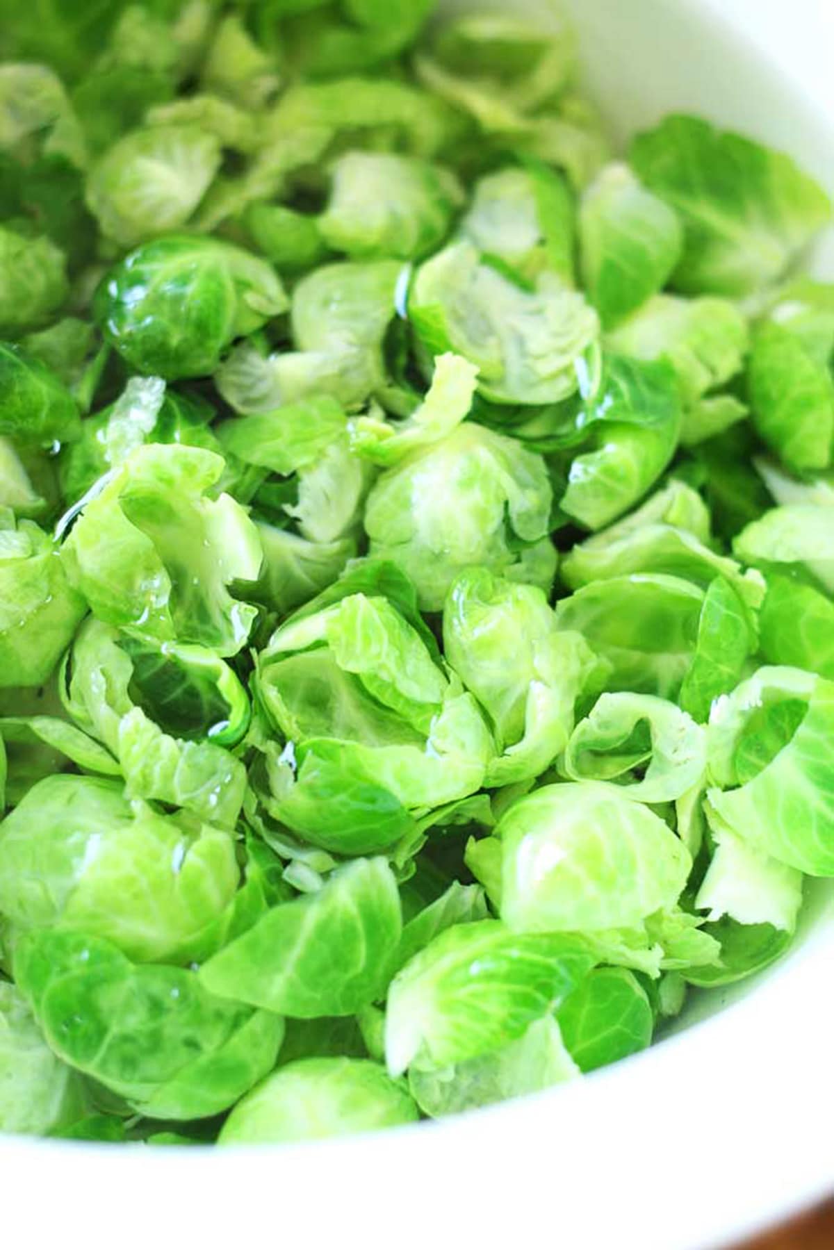 Blanched Brussel Sprouts in a bowl of ice water.