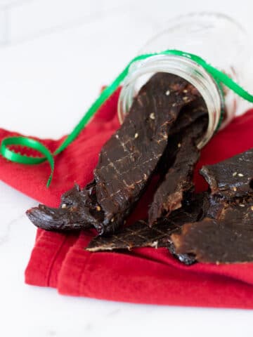 Dehydrated beef jerky on a white counter.