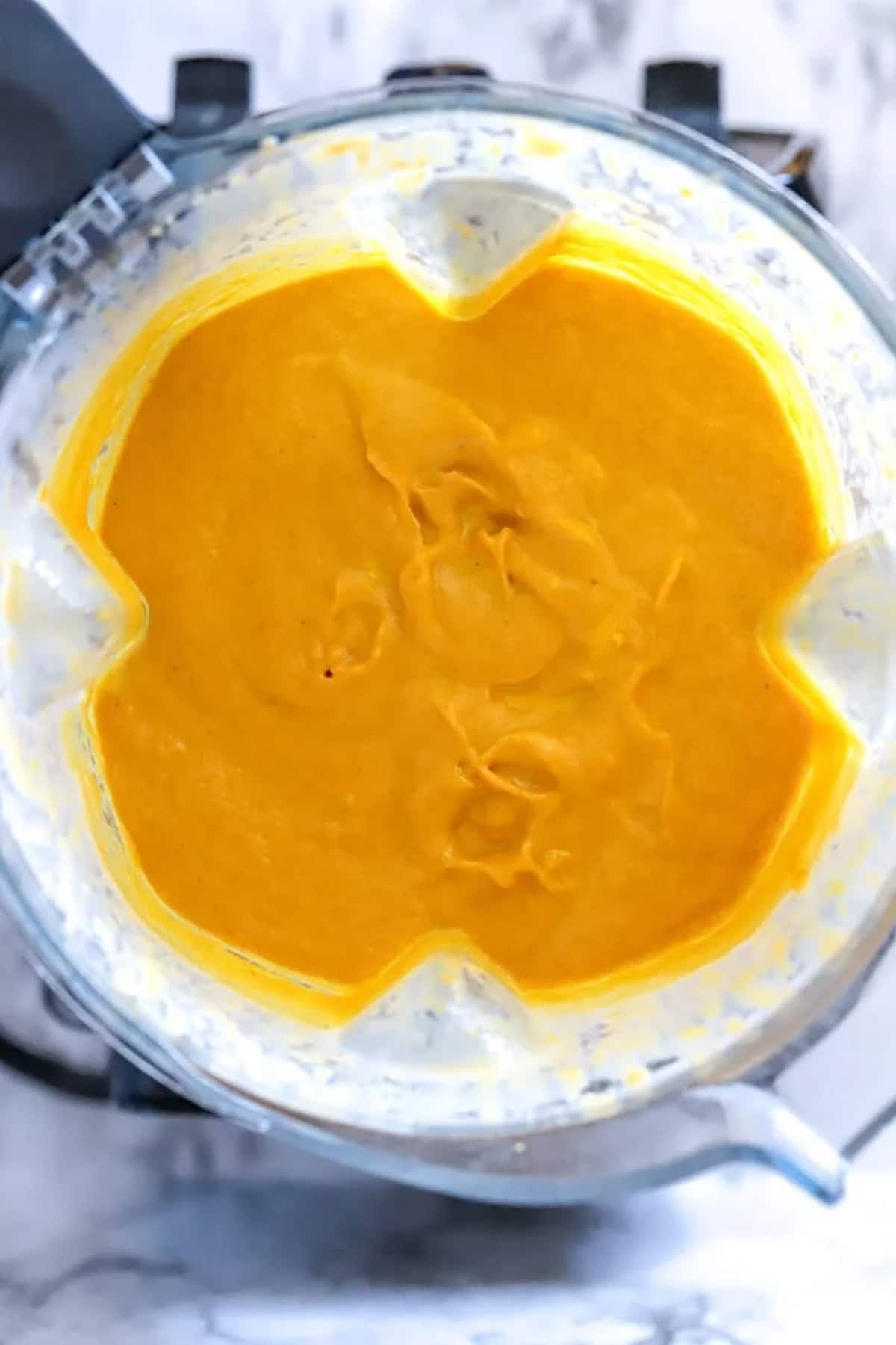 Creamy pumpkin gelato in a blender.
