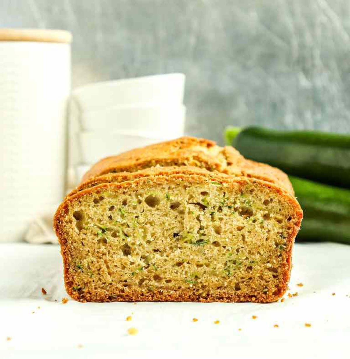 Cut zucchini bread on a counter.