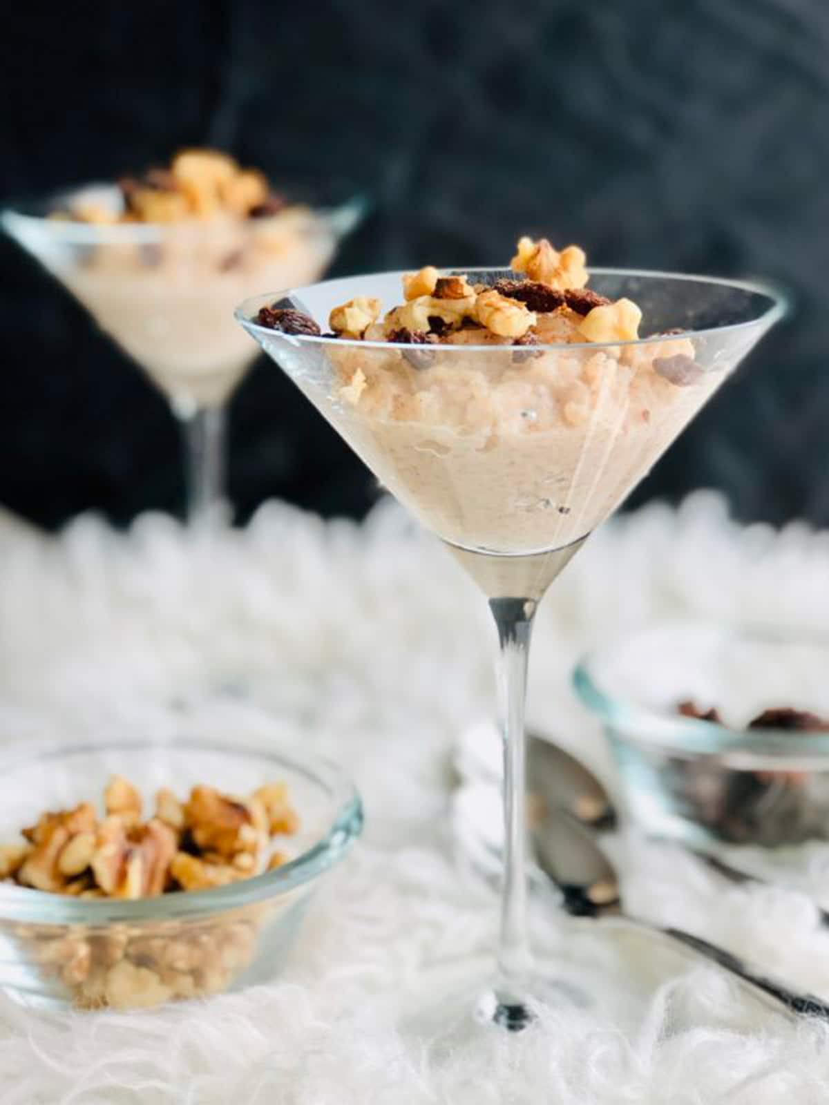 rice pudding topped with nuts in a martini glass. 