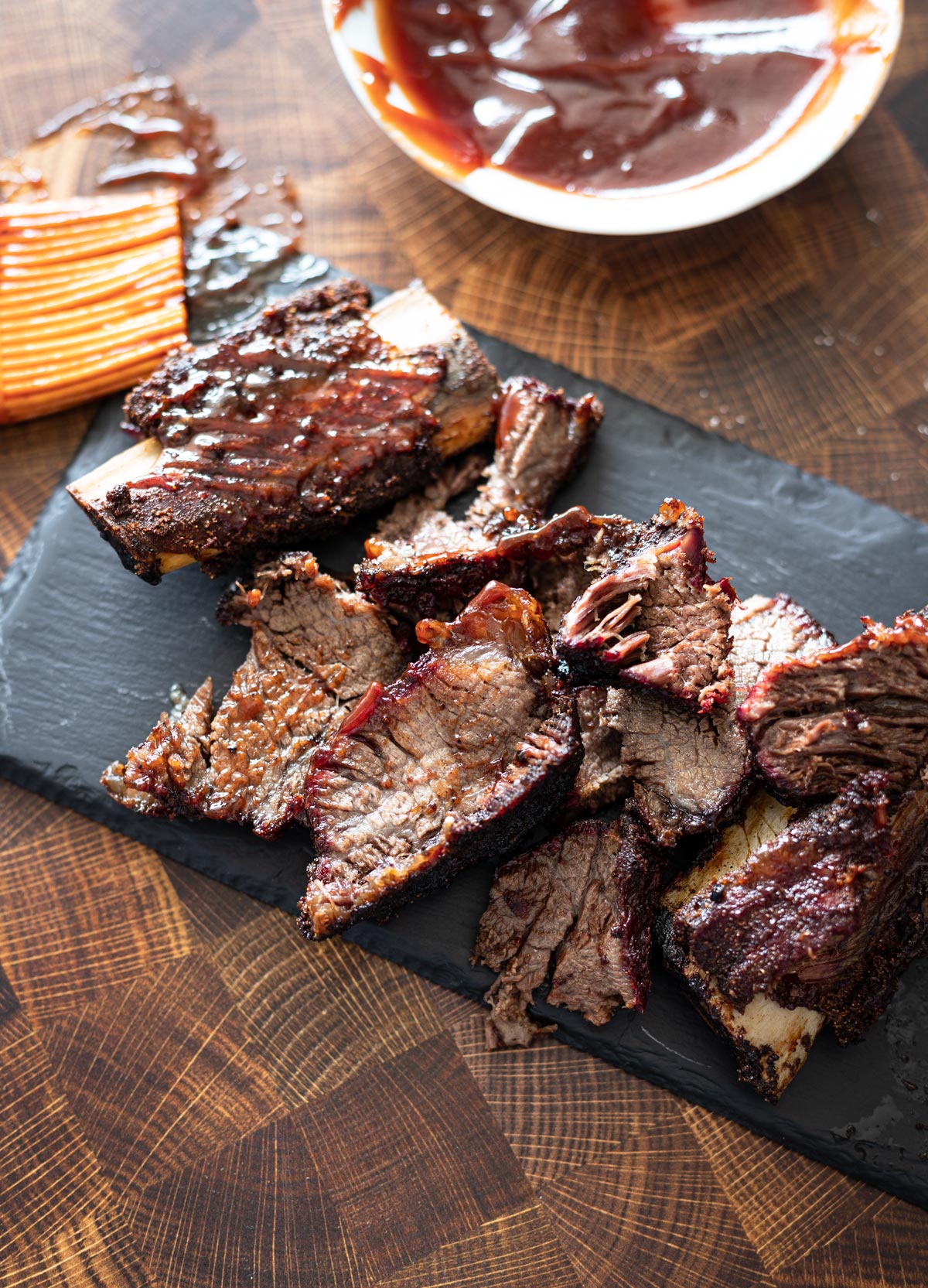 Sliced short ribs lathered in BBQ sauce. 