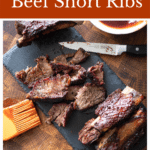 Sliced smoked beef short ribs on a plate.