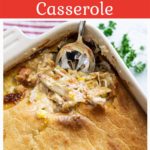 Chicken pot pie casserole with a spoon scooping out a serving