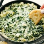 spinach and artichoke dip in a skillet.