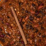 Large pot of Three Bean Chili with a cinnamon stick.