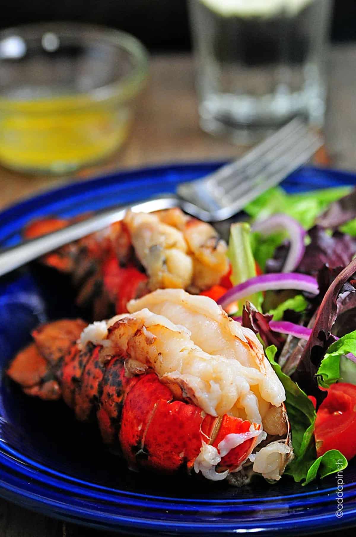 Smoked lobster tails on a platter.