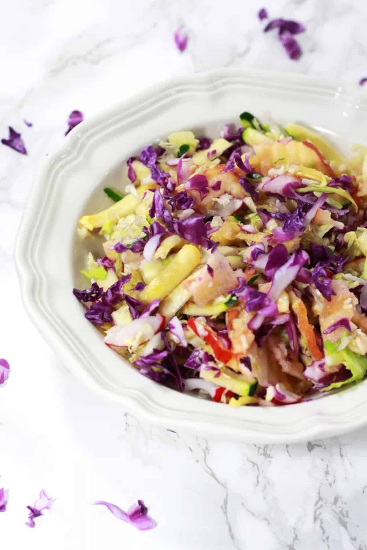 Sweet coleslaw with fruit and vegetables in a bowl. 