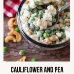 Bowl of cauliflower salad with spoon in bowl.
