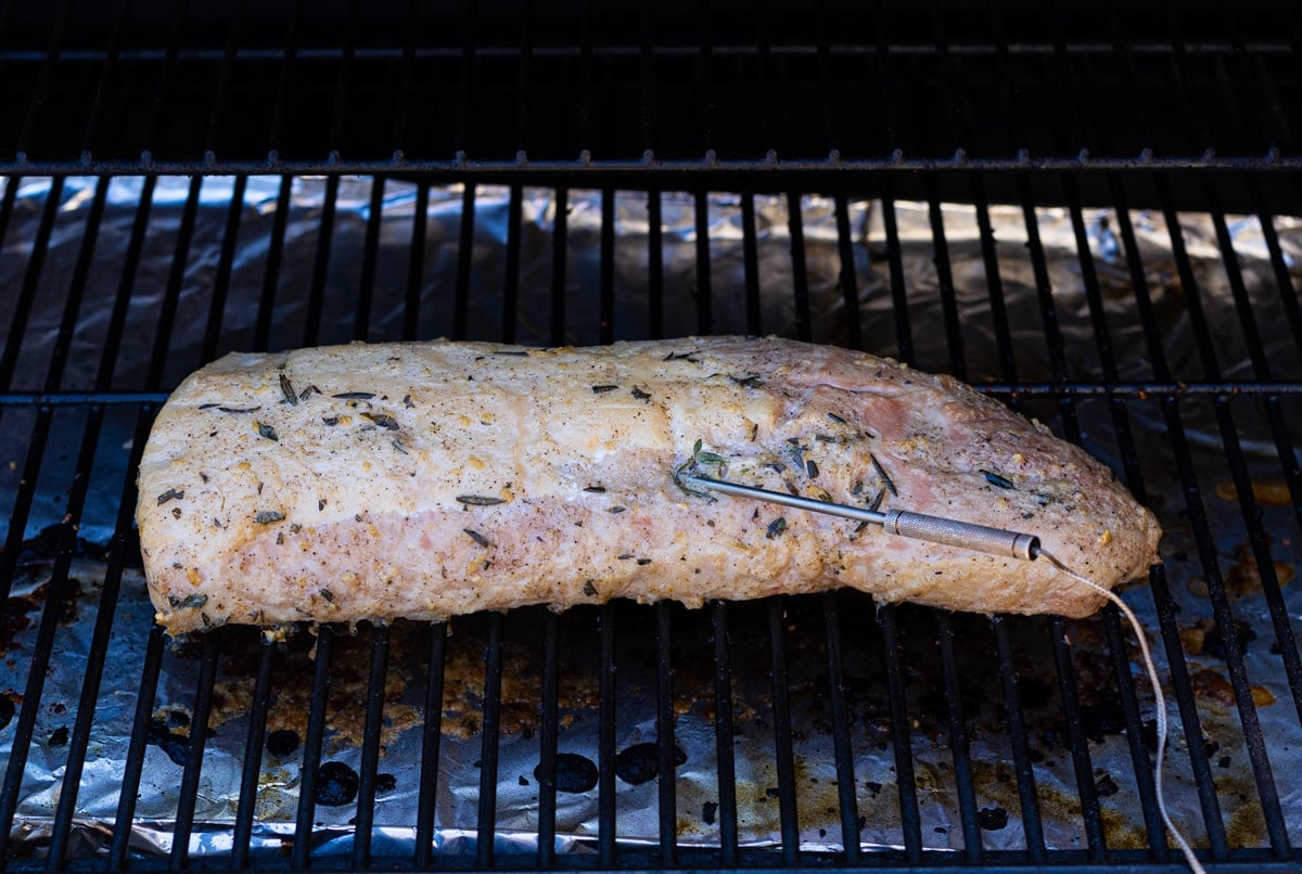Pork loin on the smoker grates after it has reached temperature. 