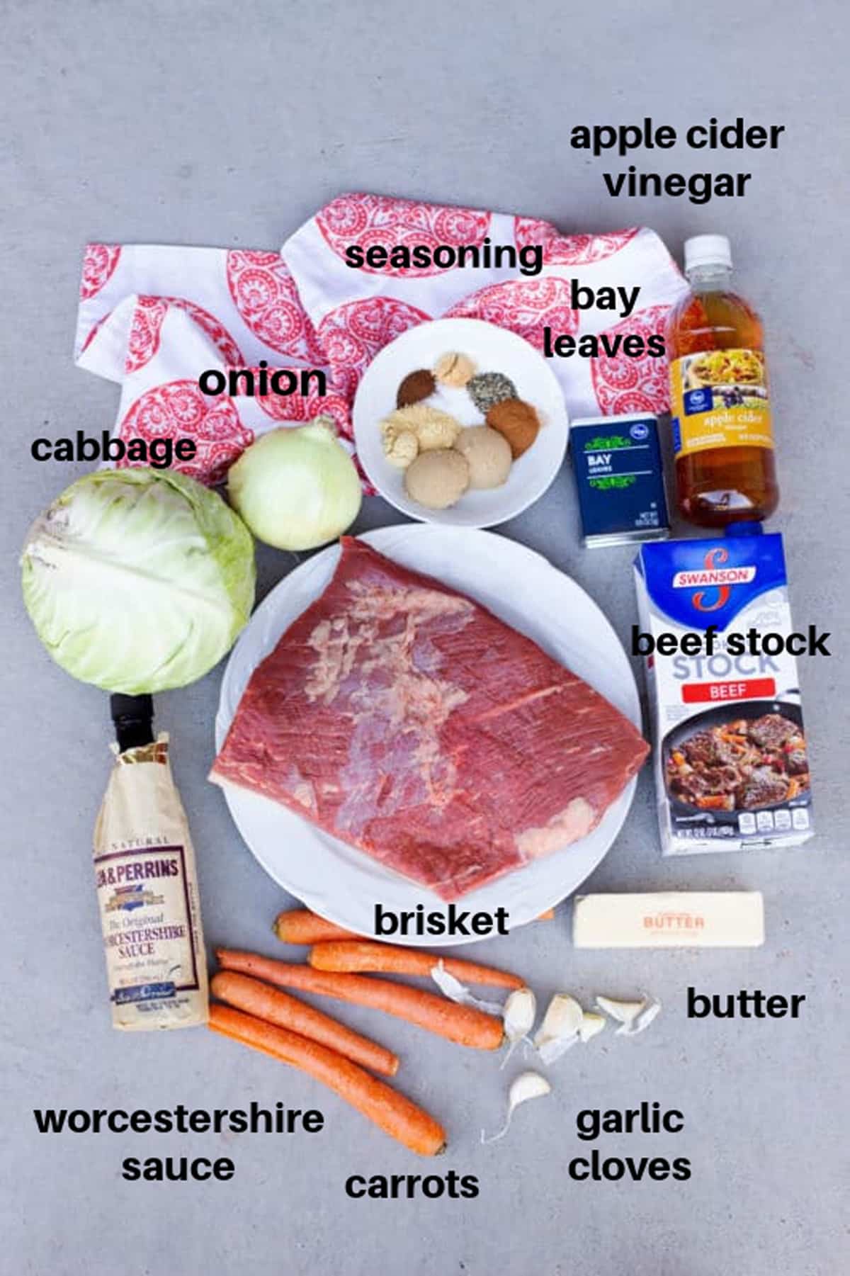 Different ingredients on a counter to make a slow cooker beed brisket. 