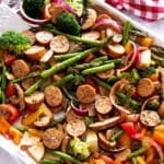 Sheet pan dinner filled with roasted vegetables and sausage.