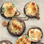 Shrimp stuffed mushrooms being served.
