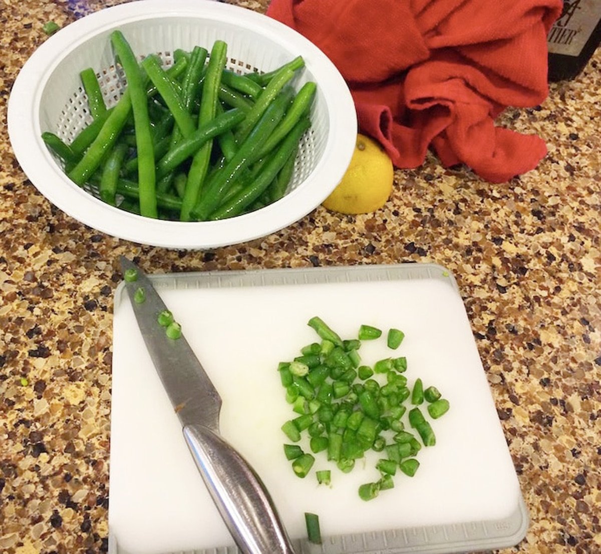 Bowl filled with cut green beans. 