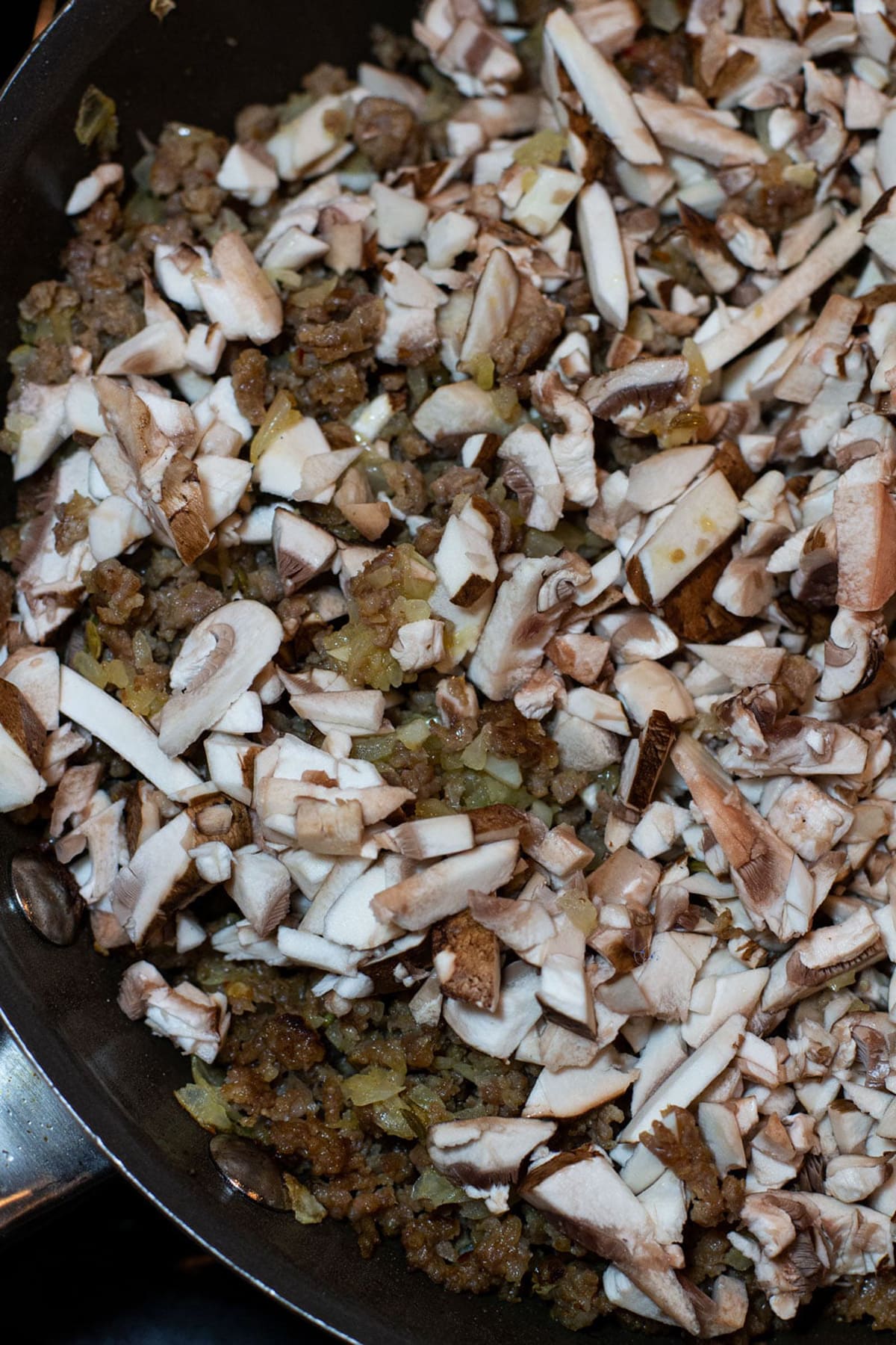 Sauteed mushrooms in a skillet.