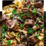 Close up of a picture of Instant Pot beef tips being served with noodles.