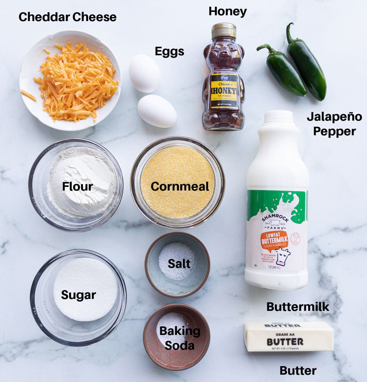 All the Jalapeno cornbread ingredients you need spread on a counter for making cornbread. 