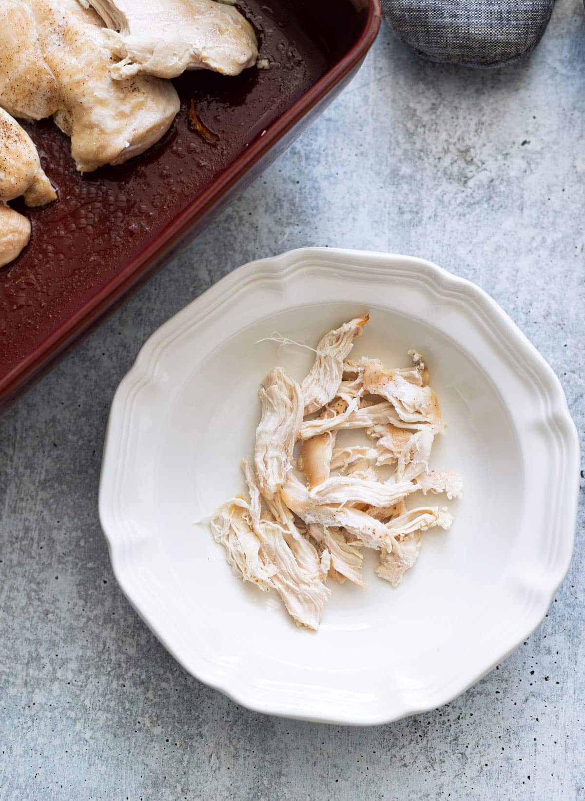 Fresh cooked shredded chicken in a bowl.