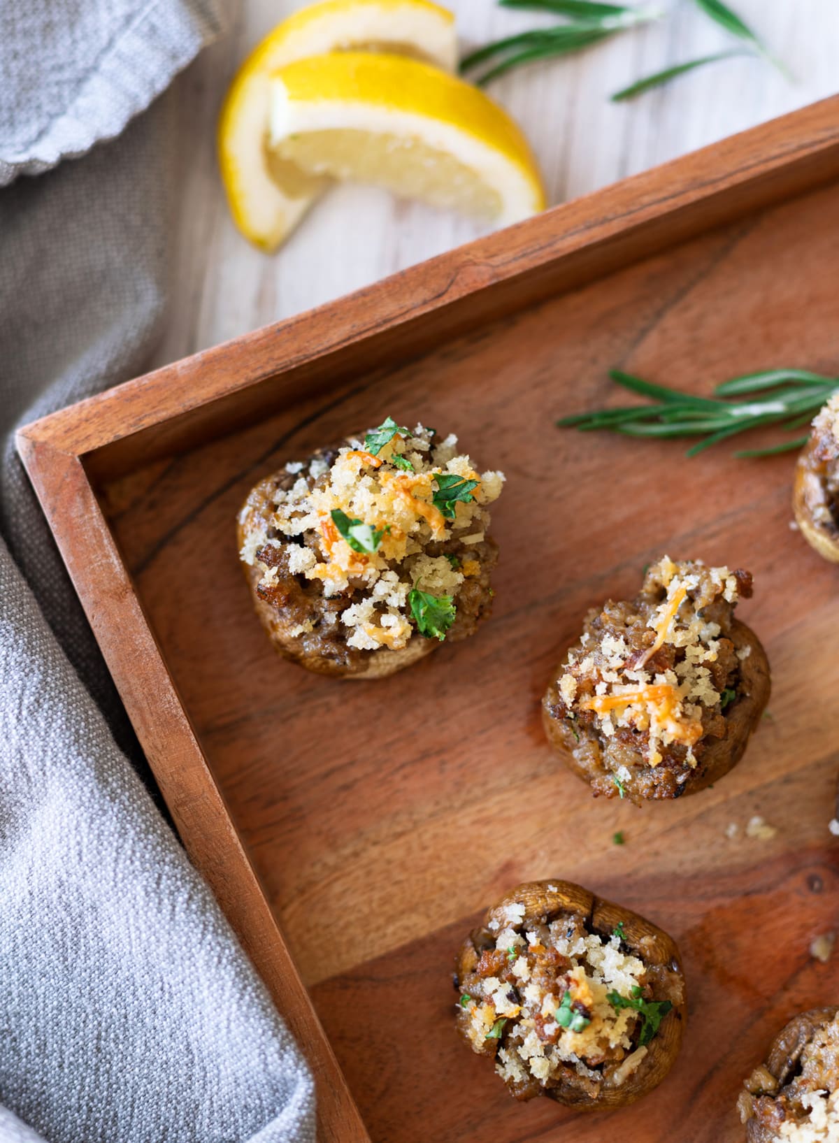 Close up of a stuffed mushroom on a platter.