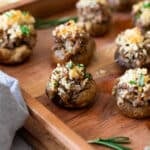 Close up of a mushroom stuffed with sausage and cheese.