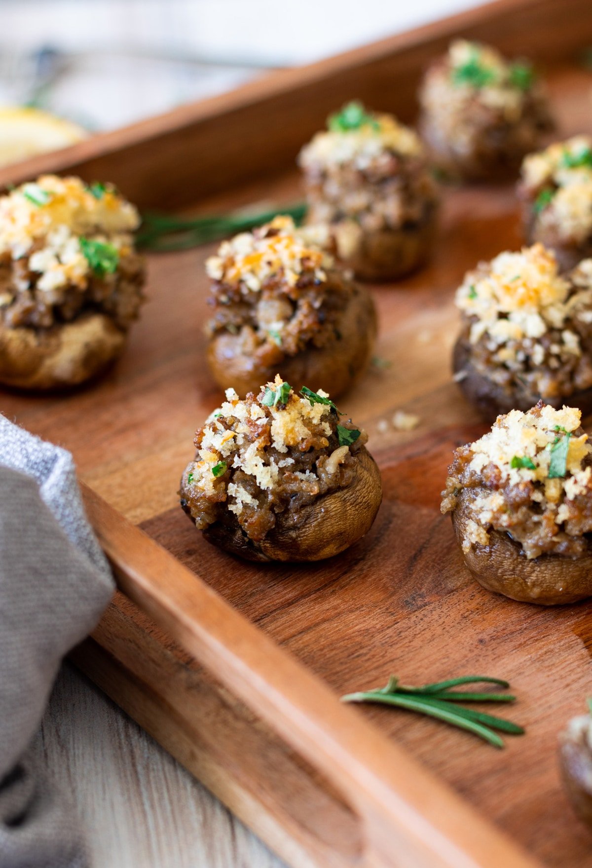 Platter filled with sausage stuffed mushrooms.