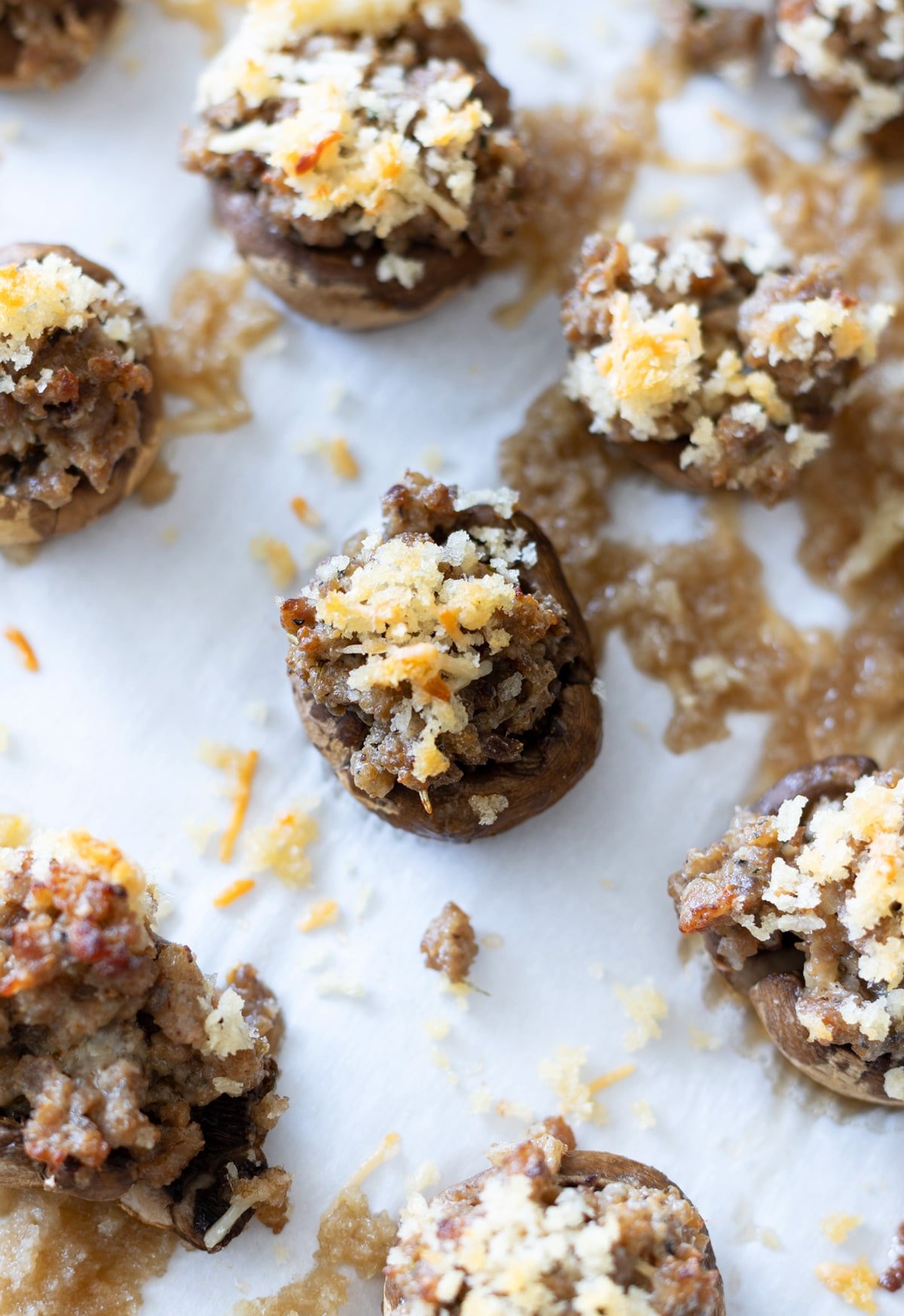 Close up of a sausage stuffed mushroom.
