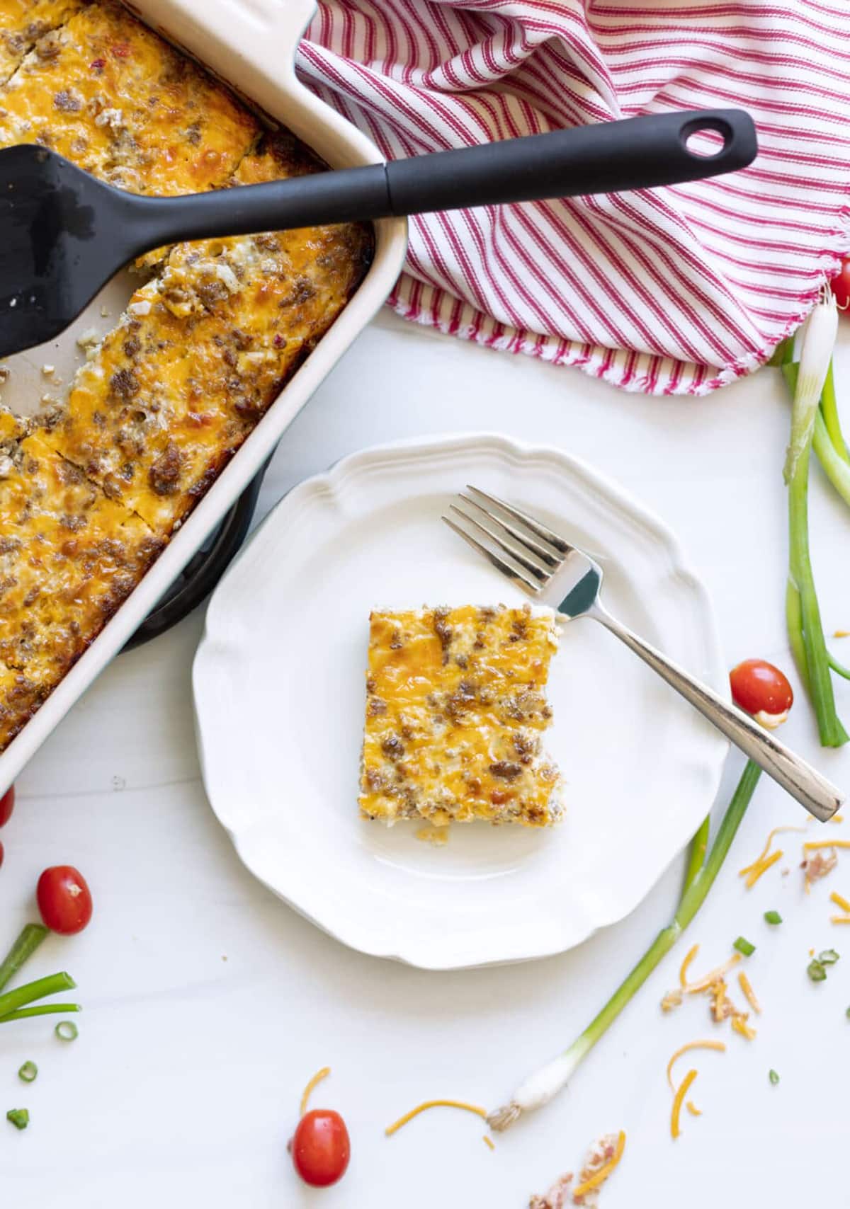 Piece of hash brown casserole on a plate.