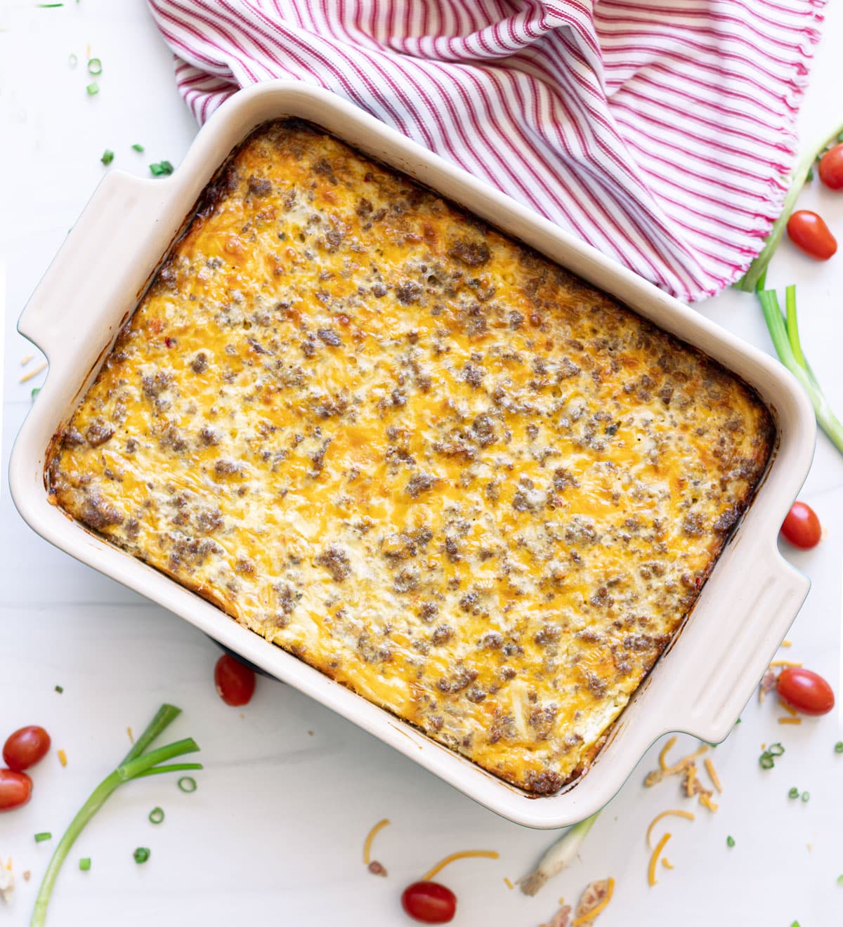 A pan of hash brown breakfast casserole ready to be cut. 