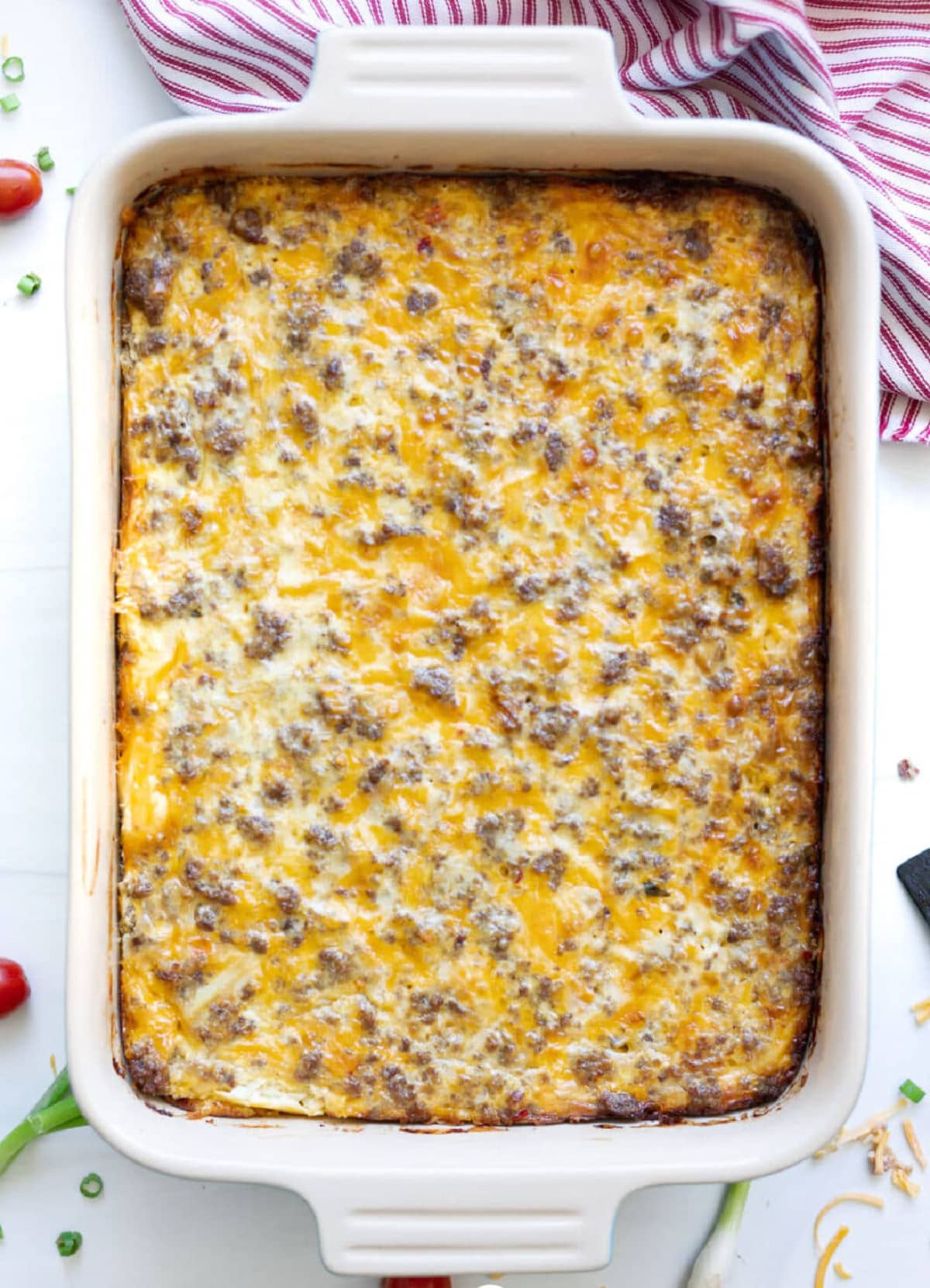 Baked hash brown casserole in a baking dish ready to be served. 