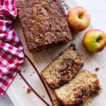 Sliced apple cinnamon bread on a cutting board.