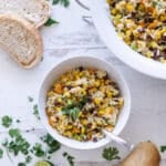 Bowl filled with corn and black bean salad.