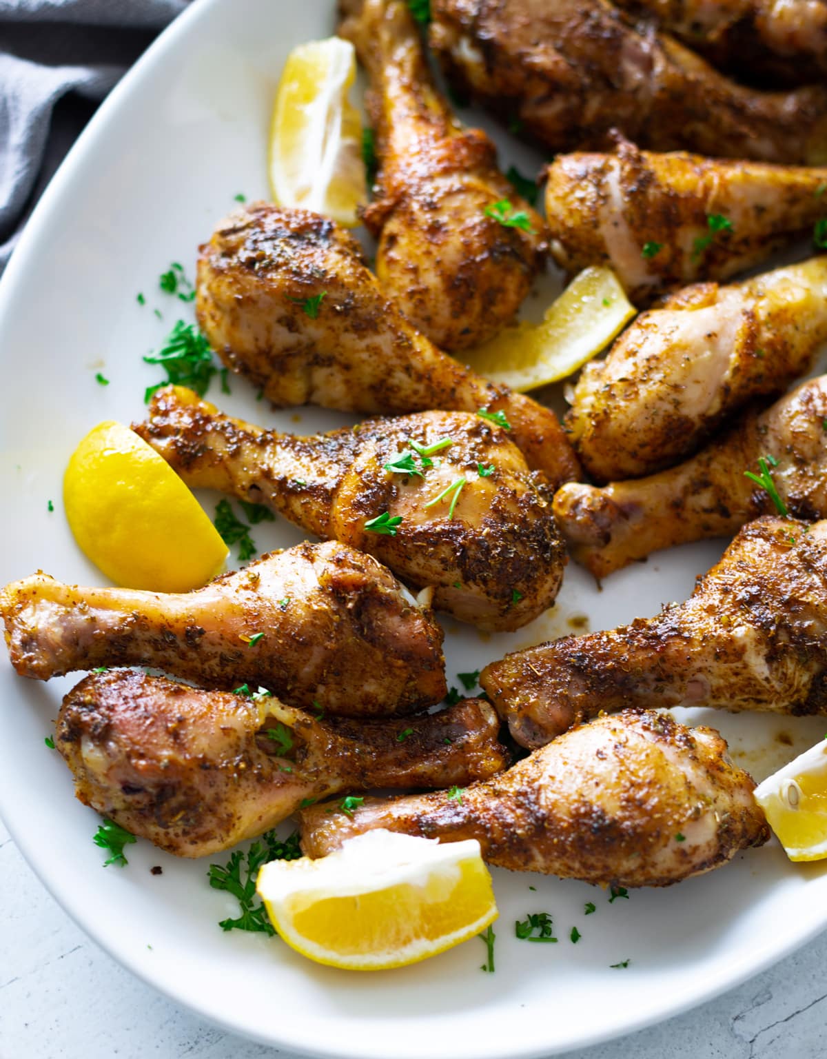 Close up of seasoned backed chicken legs.