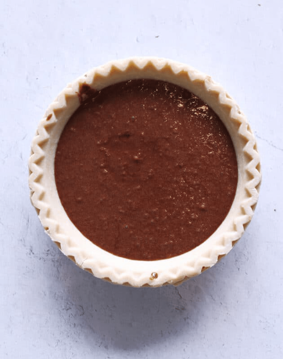 Pie shell filled with chocolate pie mix.